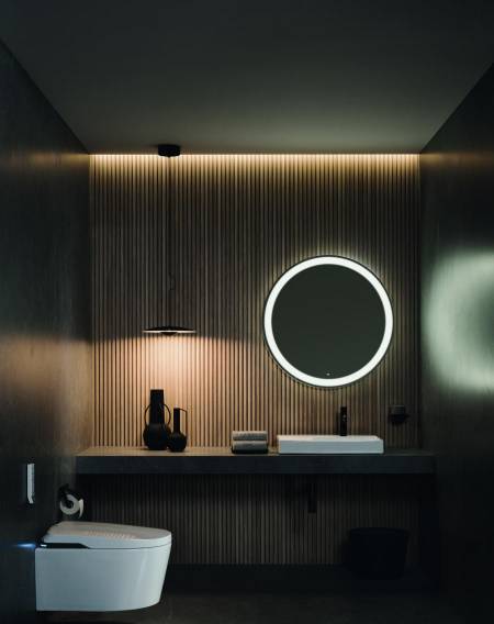 Reformas de banheiro com espelho redondo com iluminação LED